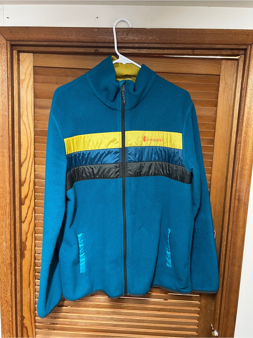 cotopaxi Teal Fleece Jacket with Yellow and Black Stripes